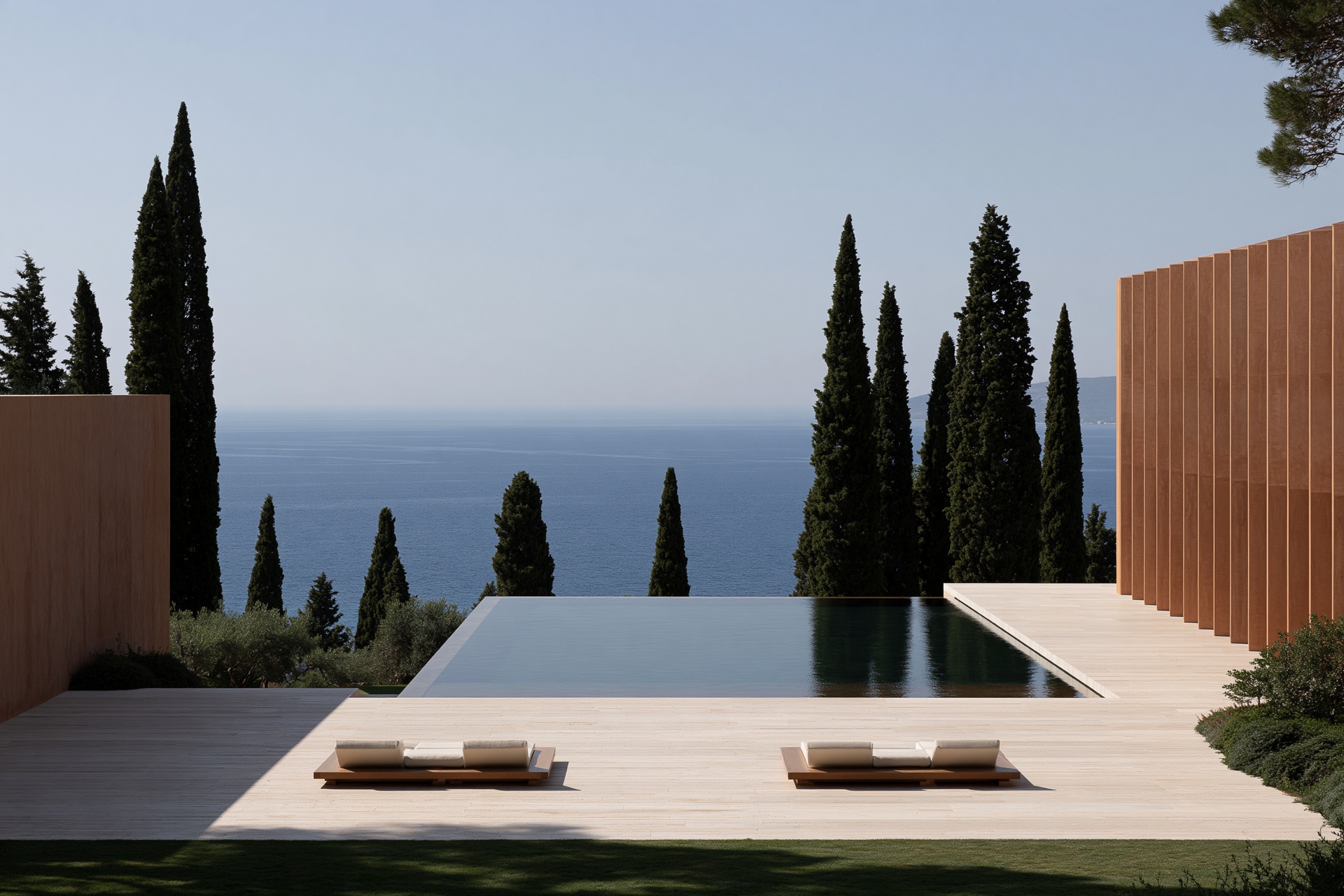 Infinity pool between cypress trees above the Mediterranean